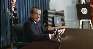 President Nixon with copies of edited White House transcripts