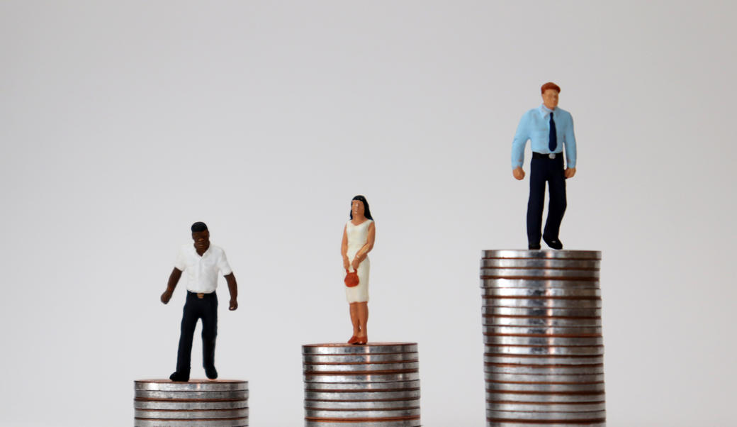 people dolls on stacks of coin