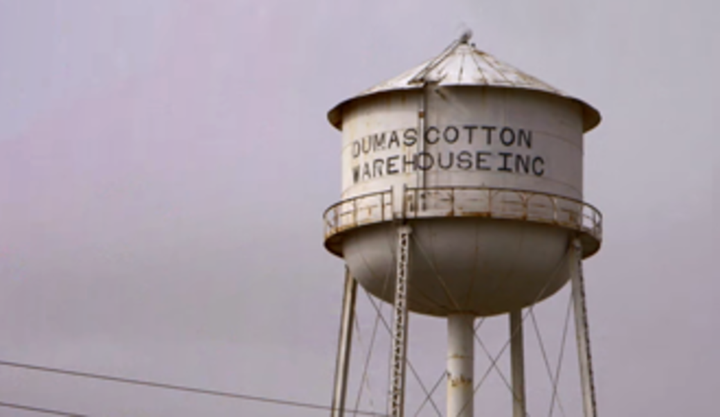 Old water tower against a purple sky