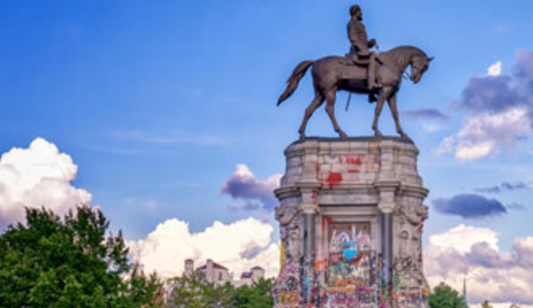 Statue of Robert E. Lee on horseback with graffiti