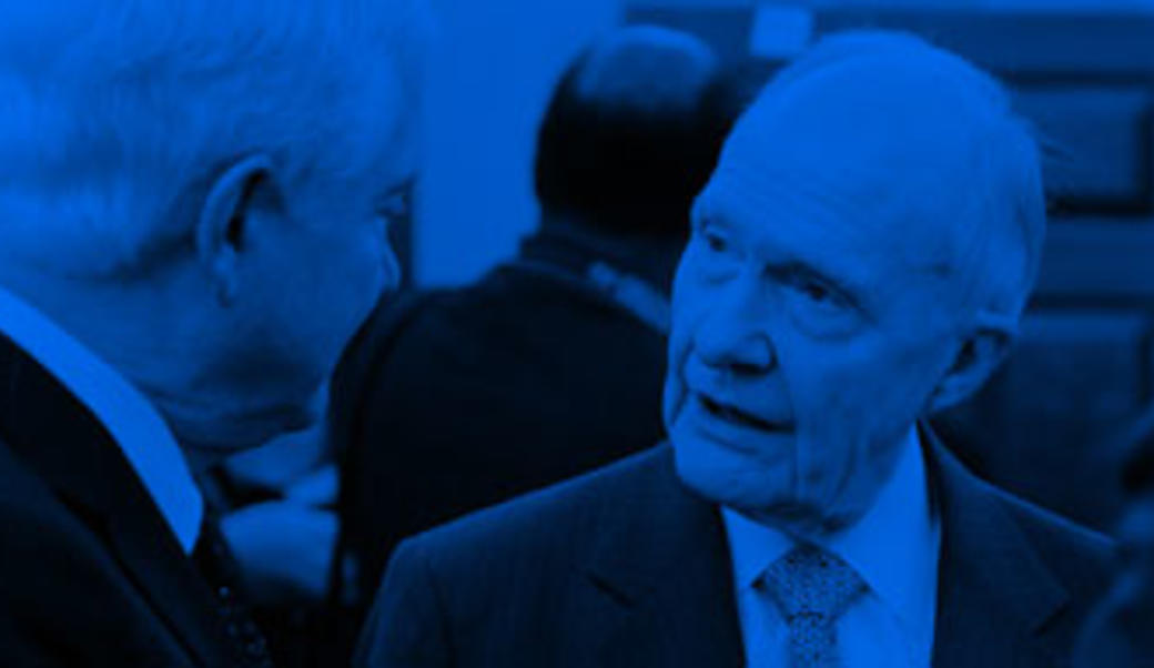 Brent Scowcroft talking to Robert Gates, picture in blue and black