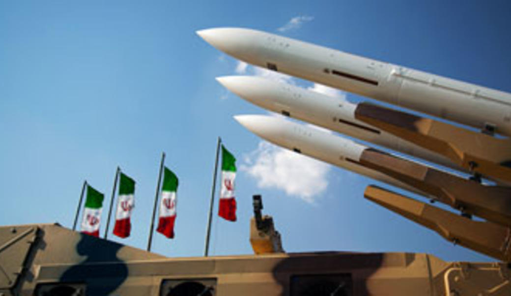 Missiles against blue sky with Iranian flags