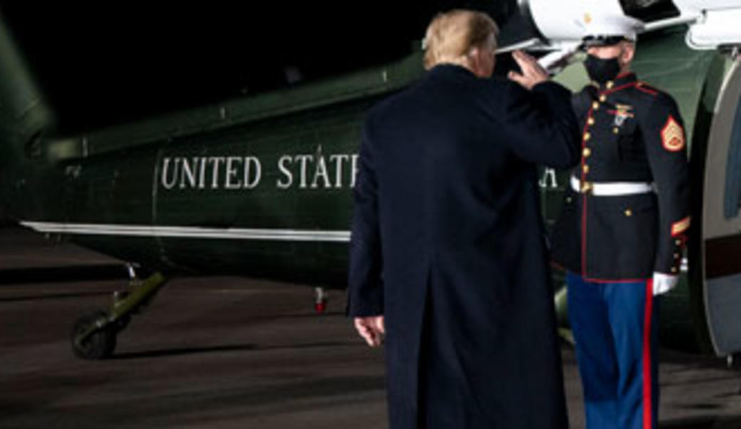 Donald Trump saluting Marine on way into Marine One helicopter