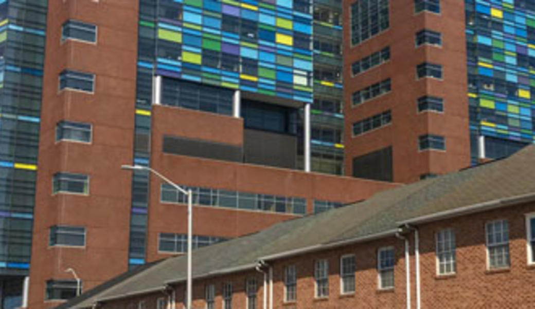 Johns Hopkins Hospital behind rowhouses on Orleans Street in Baltimore, MD