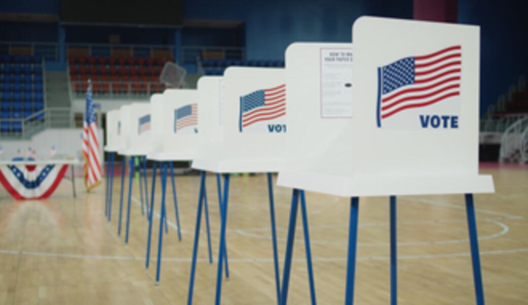 election voting booths and American flags