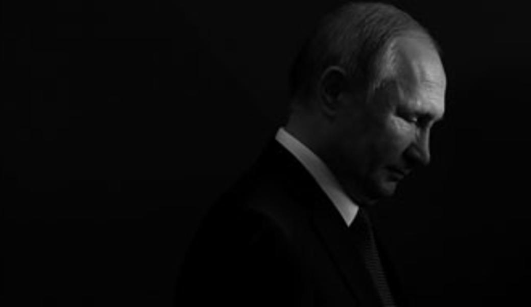 Vladimir Putin in dark silhouette