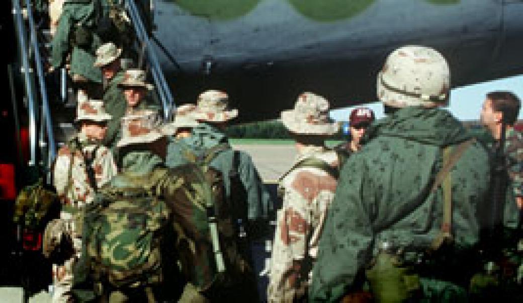 U.S. troops board C-130